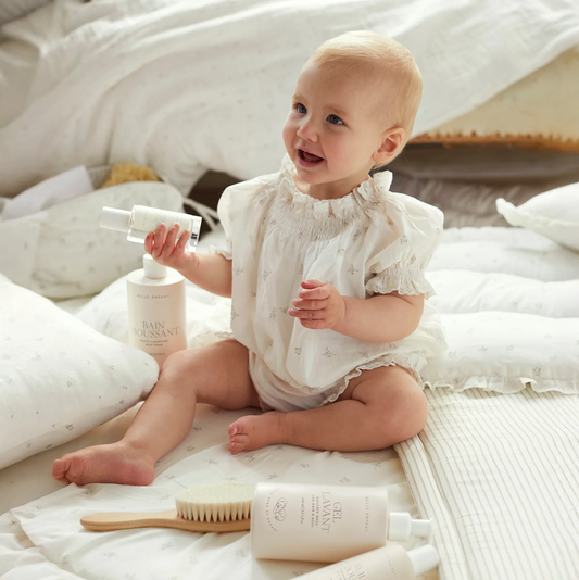 Baby enjoying Belle Enfant beauty products gift set