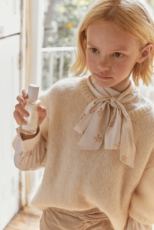 girl holding belle enfant l'eau de belle enfant fragrance