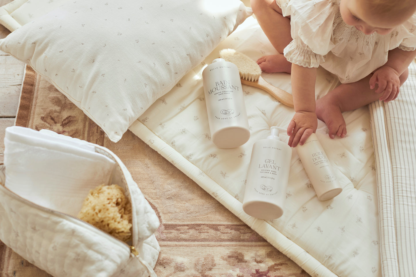 Baby in belle enfant blouse enjoying luxury baby beauty collection