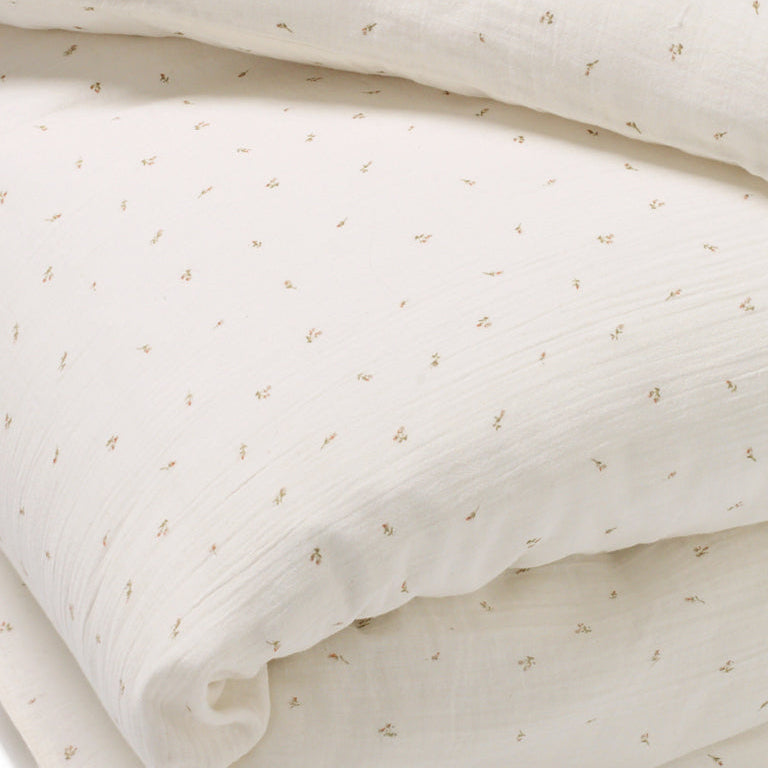 Close up of delicate rosebud printed duvet set for children