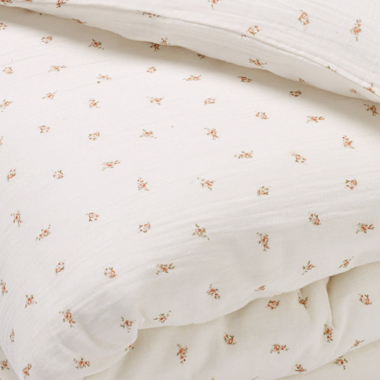 Close-up of the soft 100% cotton muslin fabric in Pink Rose print