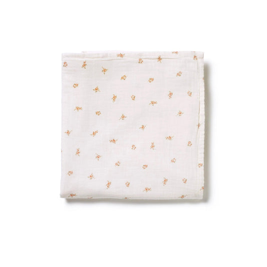 Neatly folded 100% muslin cotton swaddle in delicate pink rose print