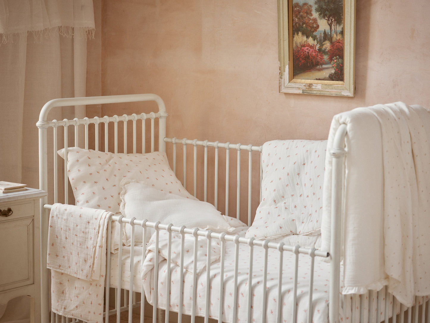 Belle Enfant Taupe Rosebud fitted sheet displayed in a nursery setting.