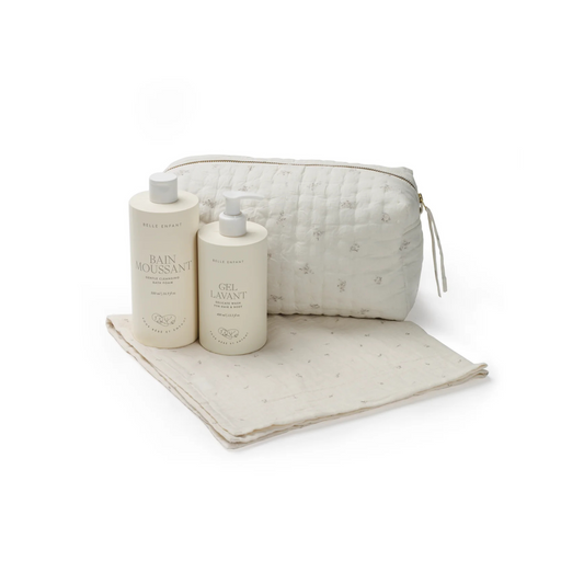 Baby Gift Set including quilted toiletry bag, muslin squares, bath foam, and hair & body wash.