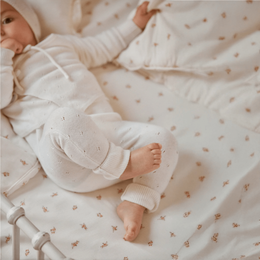 Baby in cashmere set and pink rose bedding