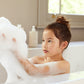 Girl enjoying luxury Belle Enfant baby and child bubble bath from Belle Enfant Beauté collection