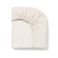 Belle Enfant fitted sheet with elasticated corners ensuring a secure fit on a cot mattress.