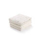 Belle Enfant muslin squares in cream, taupe rosebud, and taupe rose prints, neatly folded.