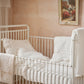 Belle Enfant Taupe Rosebud fitted sheet displayed in a nursery setting.