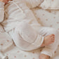 Belle Enfant Pink Rose fitted cot sheet and baby wearing 100% cashmere