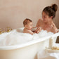 Mother and baby enjoying belle enfant luxury vegan hypoallergenic luxury bubble bath together in foaming bath