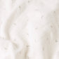 Close-up of the soft 100% cotton muslin fabric and floral print.